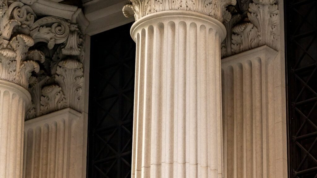 Ornate classical columns on the facade of a bank building