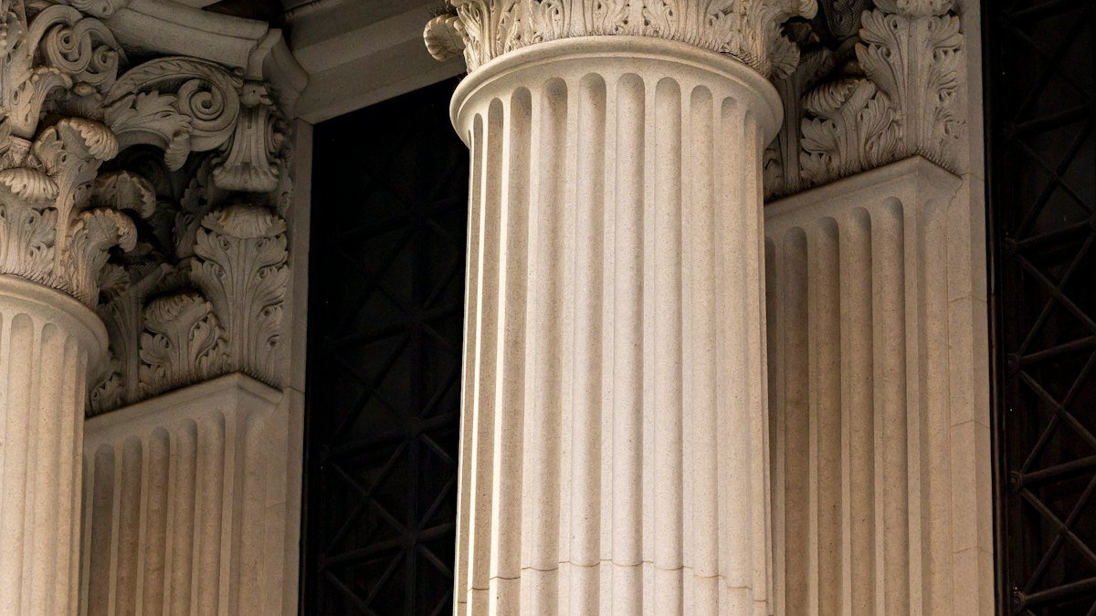 Ornate classical columns on the facade of a bank building