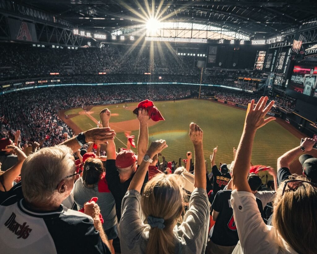 Fans celebrating a home run at a baseball playoff game