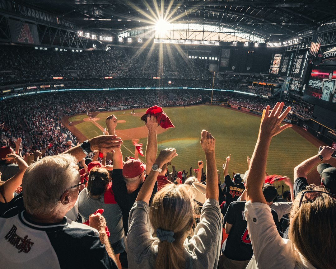 Fans celebrating a home run at a baseball playoff game