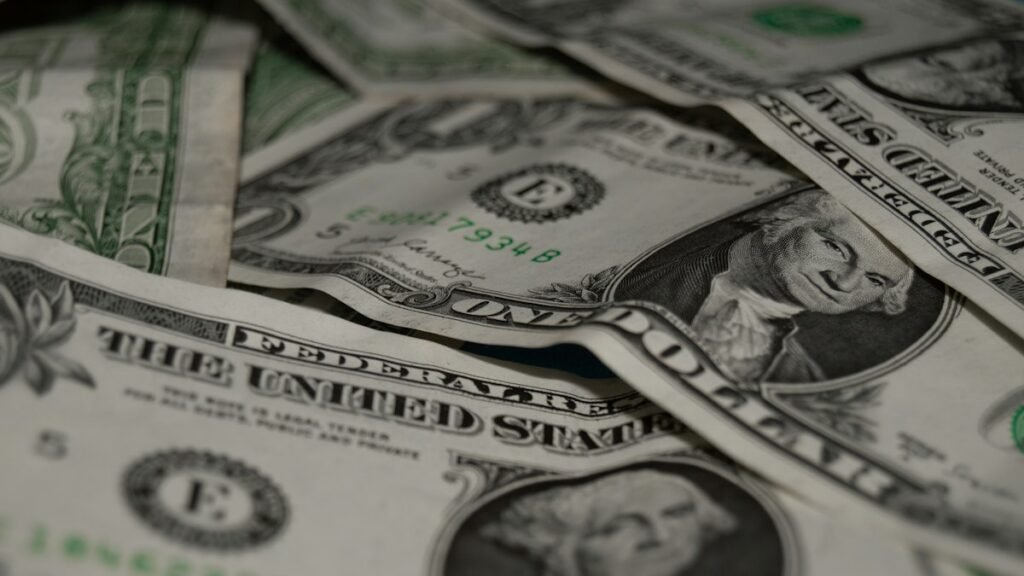 U.S. dollar bills, a stock photo illustrating the Fed rate decision and bond market pressure