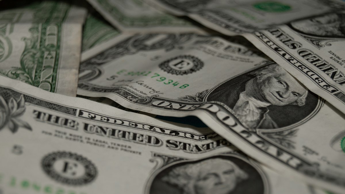 U.S. dollar bills, a stock photo illustrating the Fed rate decision and bond market pressure