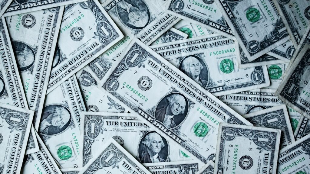 US dollar banknotes, a stock photo illustrating the Fed rate outlook